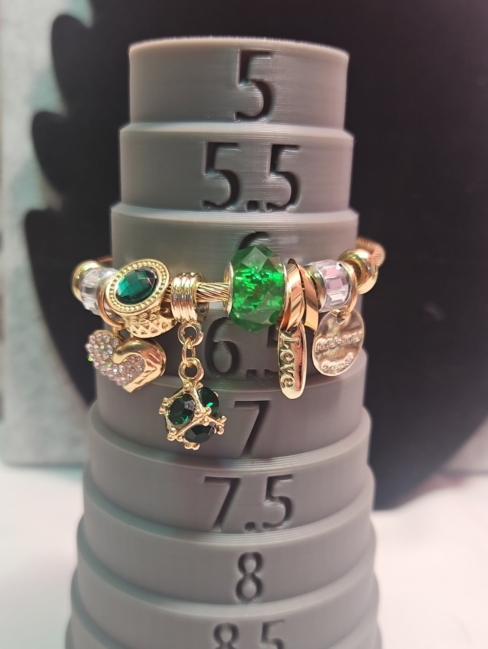 Gold-Tone Green Charm Bracelet with Crystal Accents